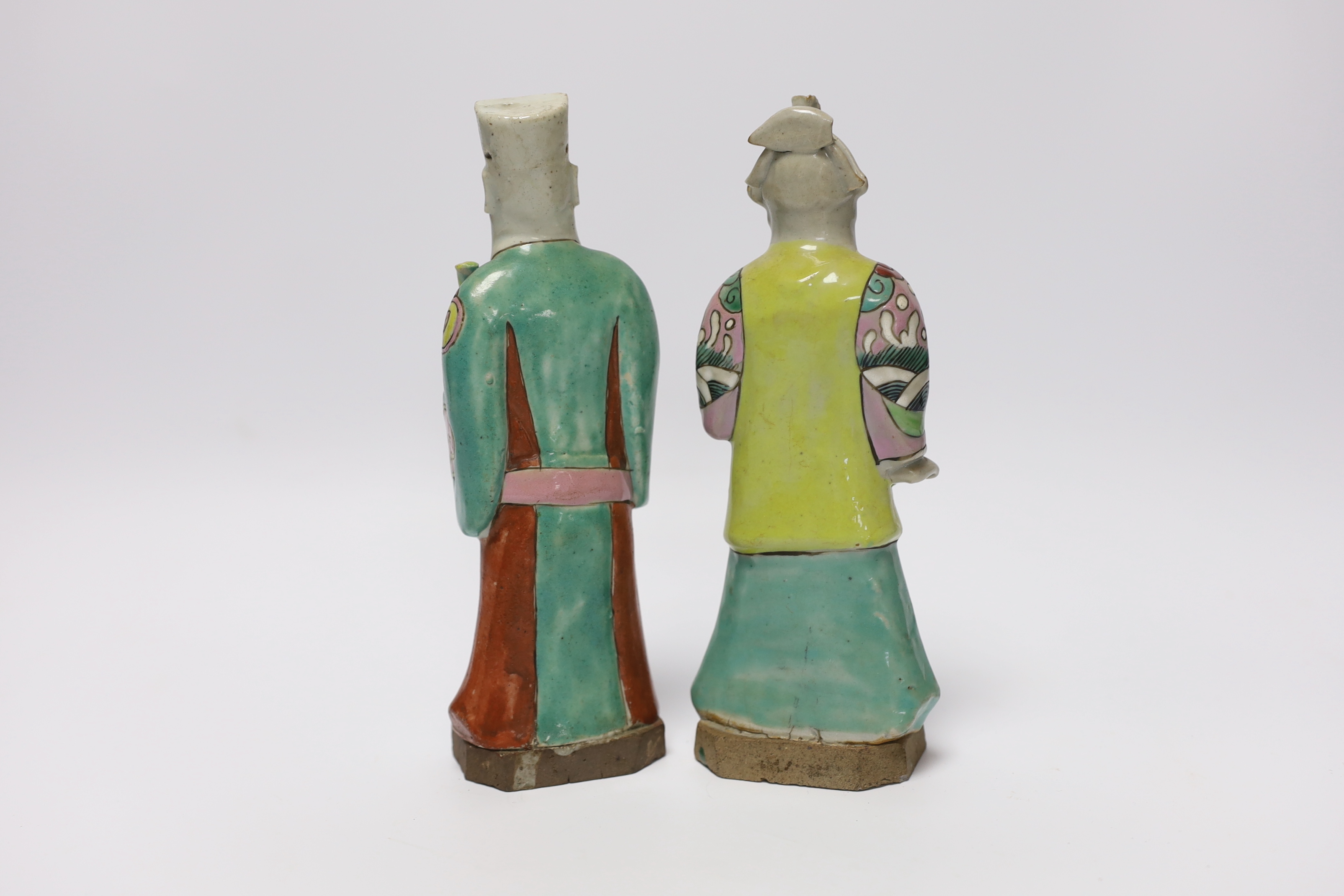 Two late 18th century Chinese enamelled porcelain figures of immortals, 19cm high